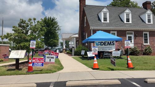 Candidate signs outside a voting building